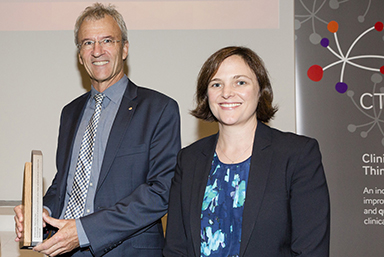 Photo of a man and a woman at an awards ceremony