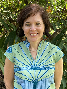 Photo of Professor Anna Ralph standing in front of plants