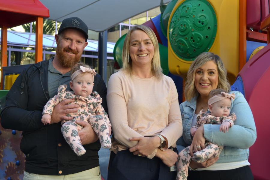 Associate Professor Alice Rumbold (centre) with Mandy and Stuart Sampson and their twin daughters Kora and Sage, who received donor milk as part of the GIFT Trial pilot program.