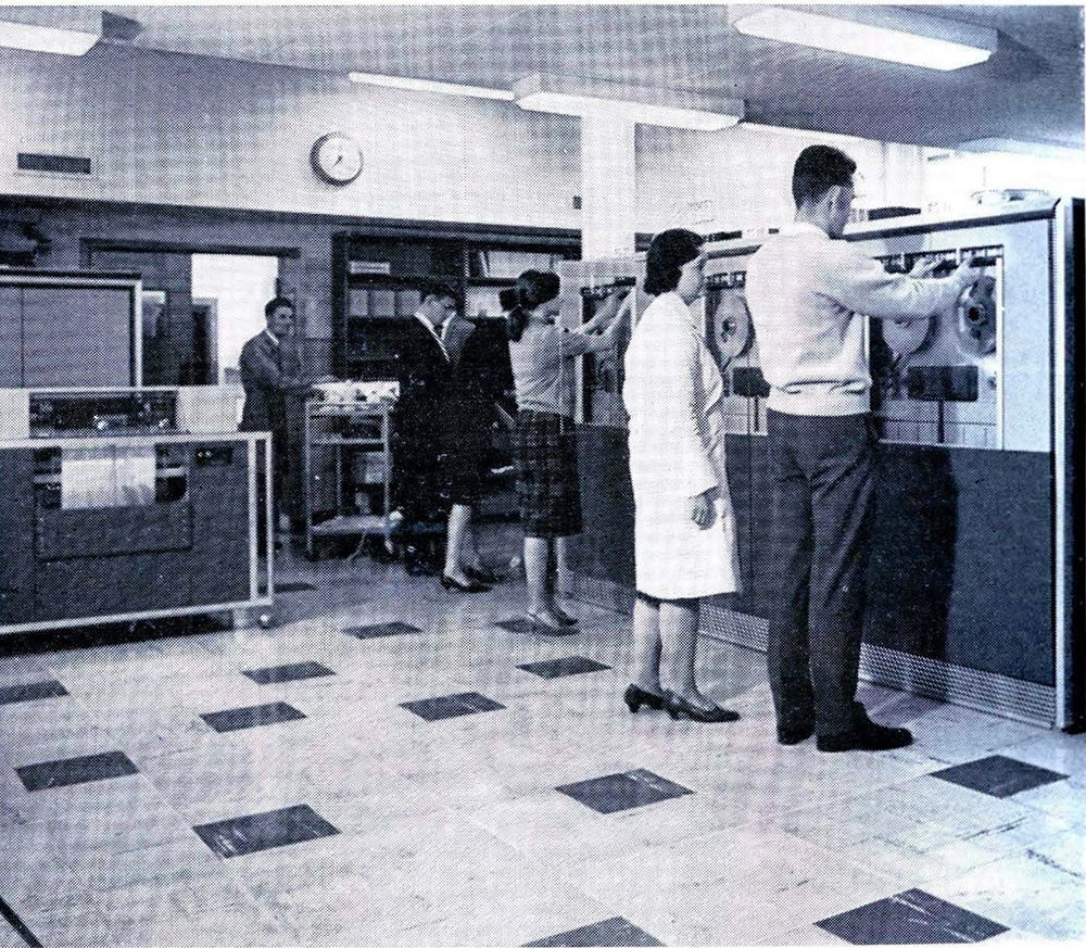 Operators working at the magnetic tape units in the Basser Computing Department