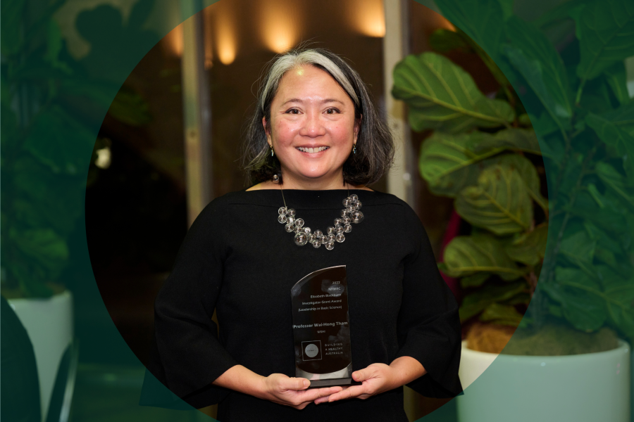 Woman holding award