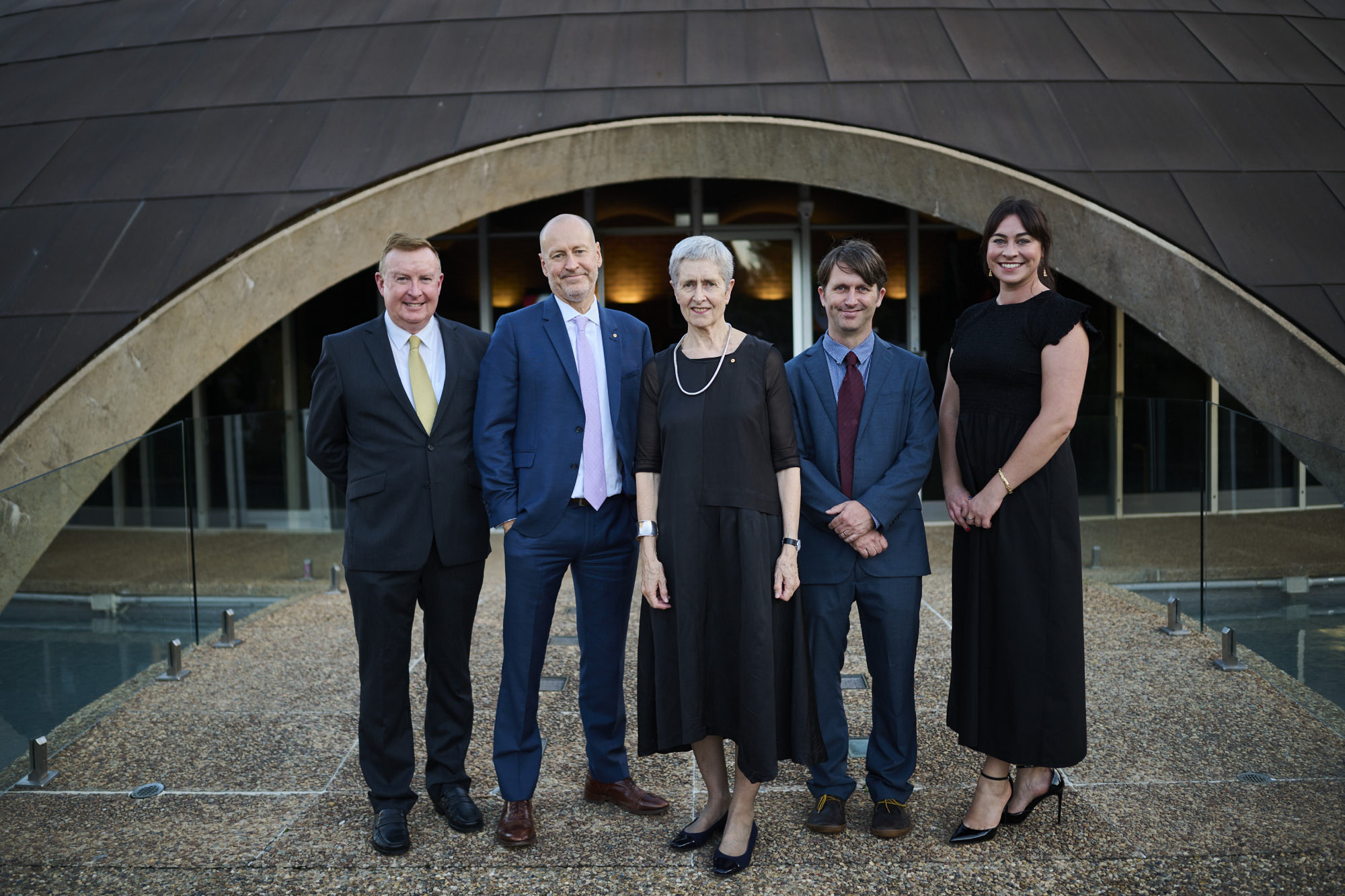 Five people standing in front of the Shine Dome, Canberra