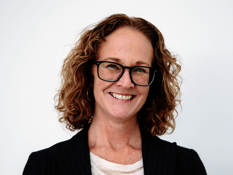 Woman with glasses smiling