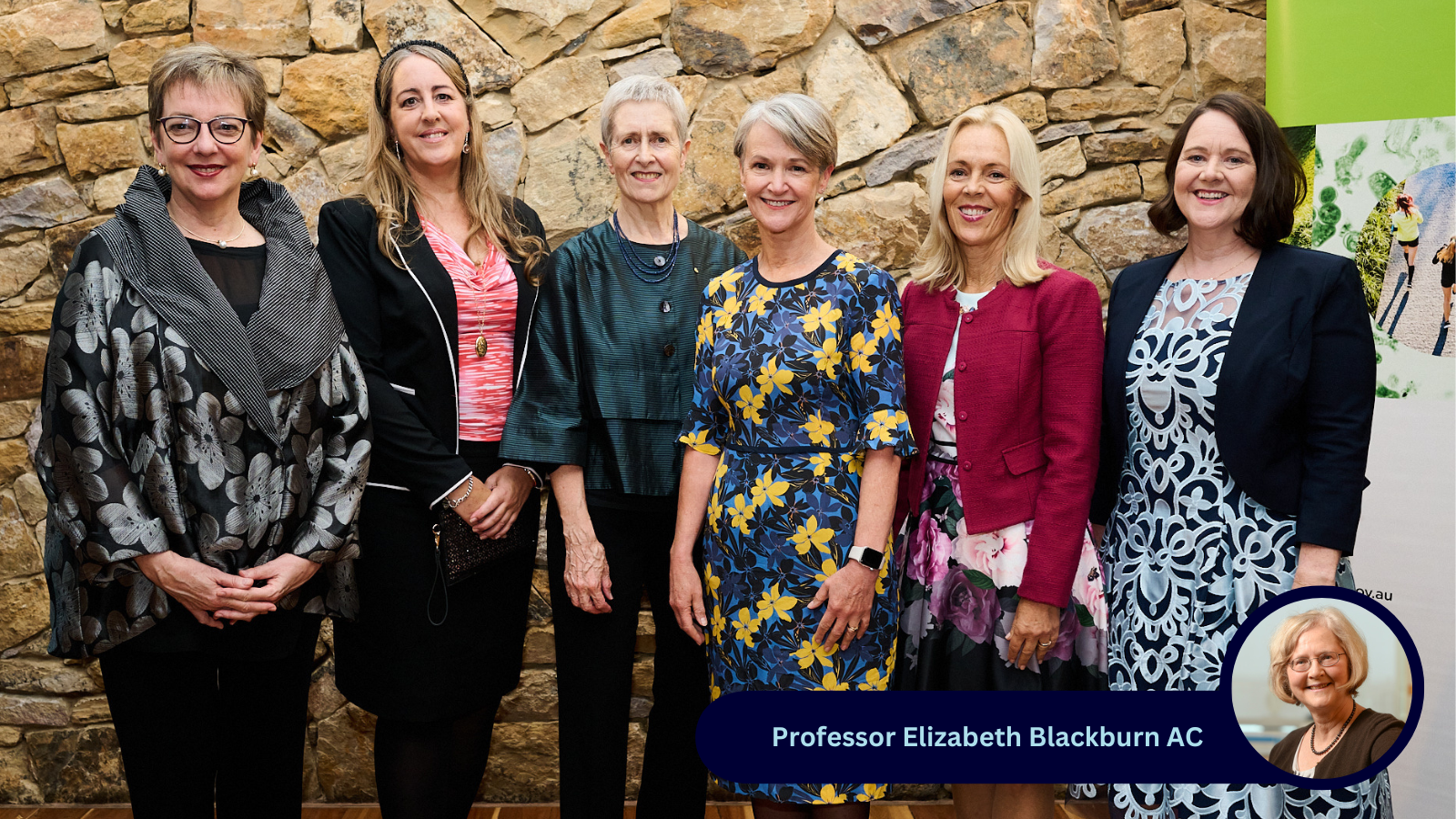 Six women standing and smiling