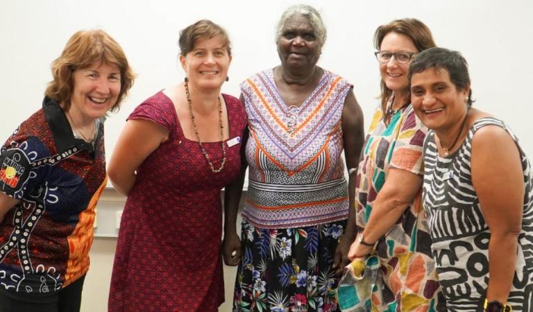 Group of people standing looking at camera
