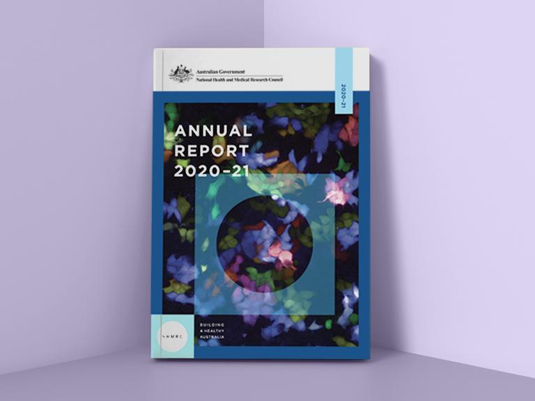 NHMRC Annual Report 2020–21 booklet placed against purple wall