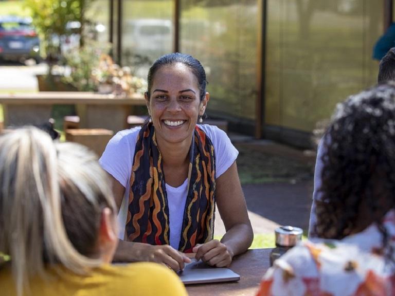 Woman talking to two other women about the guidelines