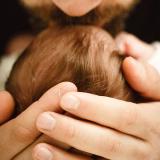 father kissing baby