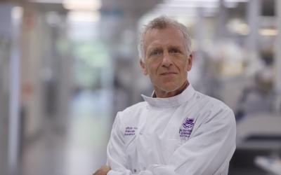 Rob Parton wearing a lab coat facing the camera