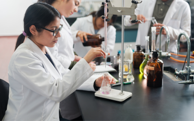 Female researcher in a lab performing an experiment