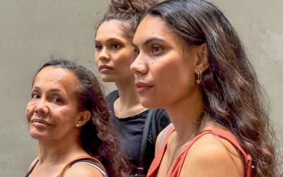 Three Aboriginal women looking into the distance