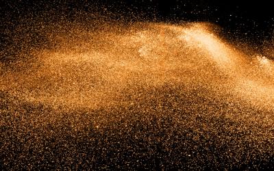 orange particles on dark back brown background