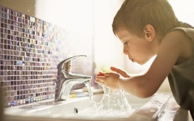 Boy splashing water