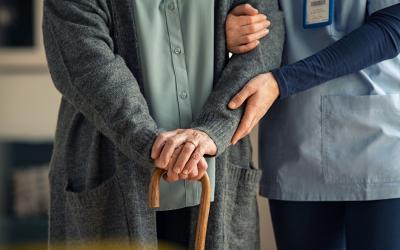 Decorative image - Aged care worker helping elderly person