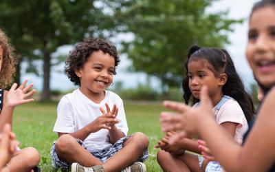 Decorative image - children sitting down outside