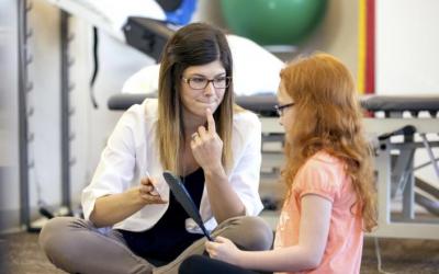 female speech therapist with a girl